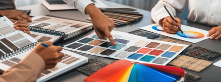 Photo for Group of professional interior designer and architect working together, planning and choosing color samples in office for house design or renovation. Insight - Royalty Free Image