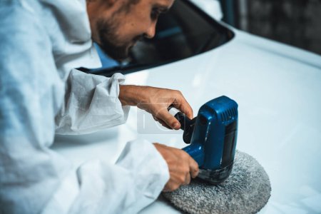 Photo for Automotive repair shop, concept of car detailing and polishing by professional car service worker with precision using orbital polisher machine creative captivating automotive flourish . Oxus - Royalty Free Image