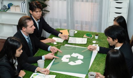 Photo for Recycle icon on meeting table in office with business people planning eco business investment on waste management as recycle reduce reuse concept for clean ecosystem. Quaint - Royalty Free Image