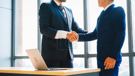 Photo for Business people handshake in corporate office showing professional agreement on a financial deal contract. Jivy - Royalty Free Image