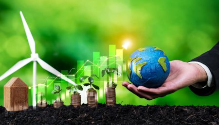 Foto de El crecimiento de moneda o dinero apilado con los empresarios de ESG sostienen que el globo terráqueo simboliza la inversión ecológica con potencial de crecimiento sostenible que conduce a un retorno financiero rentable y a la protección del medio ambiente. Dependencia - Imagen libre de derechos