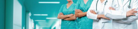 Confident medical staff team with doctor nurse and healthcare specialist professions people in hospital or clinic corridor. Medical and healthcare community in panoramic banner. Neoteric