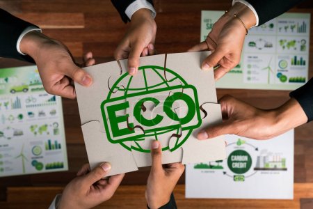Photo for Top view cohesive group of business people forming jigsaw puzzle pieces in environmental awareness symbol as eco corporate responsibility as sustainable solution for greener Earth. Quaint - Royalty Free Image