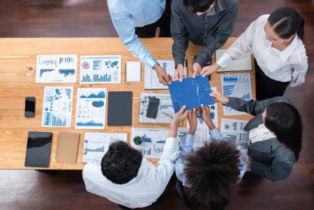 Photo for Panorama top view diverse corporate officer worker collaborate in office connect puzzle piece as partnership and teamwork concept. Unity and synergy in business success with jigsaw puzzle. Concord - Royalty Free Image