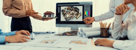 Photo for Group of interior architect designer discussing together on blueprint and laptop screen display architecture software for more precise designing layout. Modern home design and renovation. Insight - Royalty Free Image