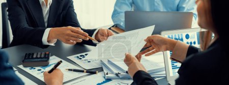 Photo for Business intelligence and data analysis concept. Analyst team working on financial data analysis dashboard on laptop screen as marketing indication for effective business strategic planning. Insight - Royalty Free Image