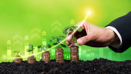 Growing coin or money stack with ESG businessman hand interacting symbolize eco investment with sustainable growth potential lead to profitable financial return and environmental protection. Reliance