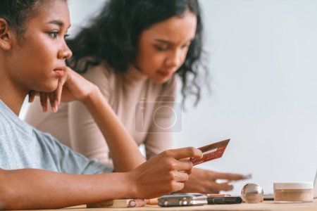 Photo for Stressed African American women has financial problems with credit card debt to pay crucial show concept of bad personal money and mortgage pay management crisis. - Royalty Free Image