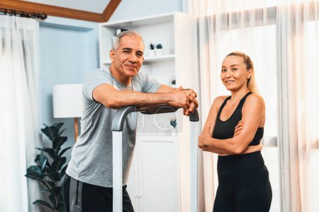 Photo for Athletic and sporty senior couple portrait in sportswear with standing posture as home exercise concept. Healthy fit body lifestyle after retirement. Clout - Royalty Free Image