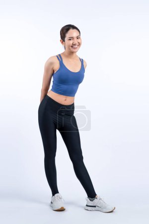 Photo for Full body asian woman in sportswear portrait, smiling and posing cheerful gesture. Workout training with attractive girl engage in her pursuit of healthy lifestyle. Isolated background Vigorous - Royalty Free Image