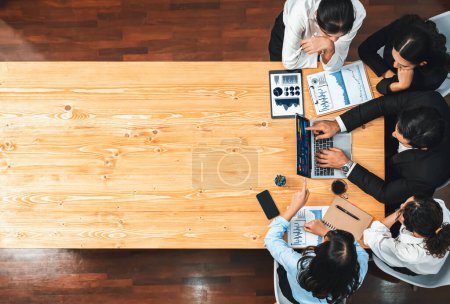 Photo for Panorama top view diverse group of business analyst team analyzing financial data report paper on meeting table. Chart and graph dashboard by business intelligence analysis. Meticulous - Royalty Free Image