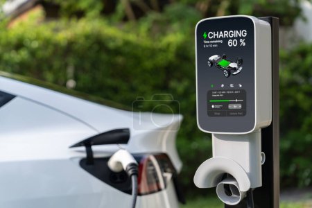 Photo for Electric vehicle technology utilized to residential area or home charging station for EV car battery recharge. Eco-friendly transport by clean and sustainable energy for future environment. Synchronos - Royalty Free Image