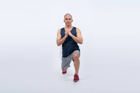 Photo for Active and fit physique senior man warming up before exercise on isolated background. Healthy lifelong senior people with fitness healthy and sporty body care lifestyle concept. Clout - Royalty Free Image