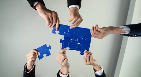 Photo for Top view panorama banner of business team assembling jigsaw puzzle over table symbolize business partnership and collective teamwork for HR recruitment and job seeker background. Shrewd - Royalty Free Image