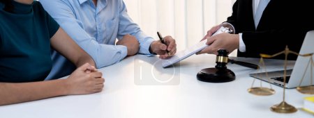 Photo for Loving couple seek legal consultation and assistance from law firm to discuss marriage law, proposal weddings and spousal support. Lawyer providing advice on marriage certification. Panorama Rigid - Royalty Free Image