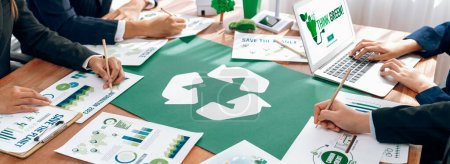 Photo for Group of business people planning and discussing on recycle reduce reuse policy symbol in office meeting room. Green business company with eco-friendly waste management regulation concept.Trailblazing - Royalty Free Image
