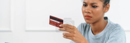 Photo for Stressed young woman has financial problems with credit card debt to pay crucial show concept of bad personal money and mortgage pay management crisis. - Royalty Free Image