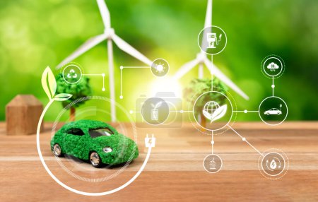 Photo for Mockup EV car and wind turbine showcasing for clean energy for sustainable future and greener Earth for net zero world. Alternative energy and environmental friendly transportation concept. Reliance - Royalty Free Image