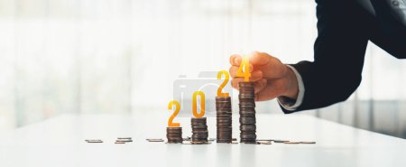 Photo for Growth coin stack symbolizing business investment and economic growth. Business people doing financial planning to achieve financial goal and contribute maximum profit on new year 2024 . Shrewd - Royalty Free Image