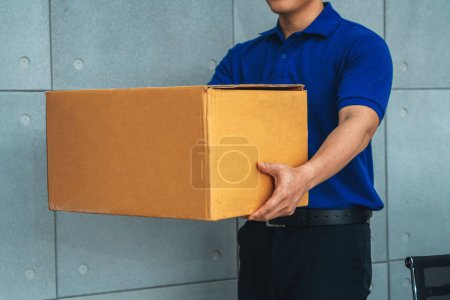 Photo for Delivery person carrying parcel box to send to customer . Delivery business concept . Jivy - Royalty Free Image