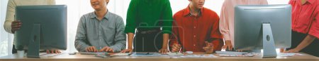 Photo for A cropped image of business group discuss about financial plan at meeting room. Successful business people brainstorm marketing idea with document and laptop placed on table. Front view. Variegated. - Royalty Free Image