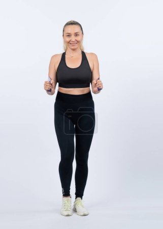 Photo for Full body length shot athletic and sporty senior woman with fitness resistance band on isolated background. Healthy active physique and body care lifestyle after retirement. Clout - Royalty Free Image