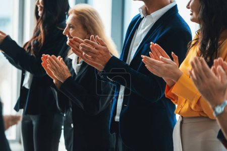 Photo for Group of business people clapping hands at successful presentation or conference. Cropped image focus on hand. Diverse male and female clapping hand to congratulate speaker. Side view. Intellectual. - Royalty Free Image