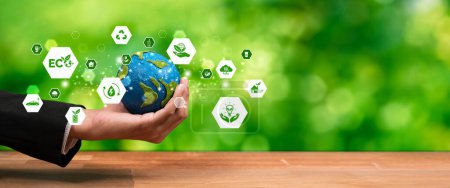 Photo for Businessman holding Earth with eco friendly icon design symbolize business company commitment to protect planet Earths ecosystem with net zero technology and ESG practice. Panorama Reliance - Royalty Free Image