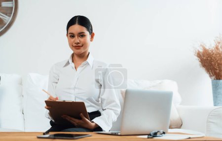 Photo for Psychologist woman in clinic office professional portrait with friendly smile feeling inviting for patient to visit the psychologist. The experienced and confident psychologist is uttermost specialist - Royalty Free Image