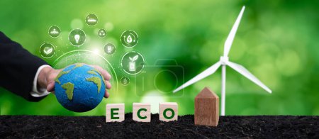 Businessmans hand holding Earth globe symbolize corporate commitment to ESG to reduce carbon emission, adopt eco friendly business to minimize environment impact for net zero world. Panorama Reliance