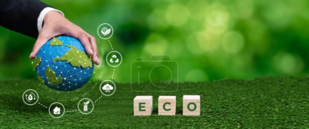 Photo for Businessmans hand holding Earth globe symbolize corporate commitment to ESG to reduce carbon emission, adopt eco friendly business to minimize environment impact for net zero world. Panorama Reliance - Royalty Free Image