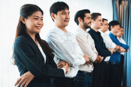 Photo for Business team standing, join and link hand together in line symbolize successful business partnership and professional synergy with diverse culture group people cooperation. Prudent - Royalty Free Image