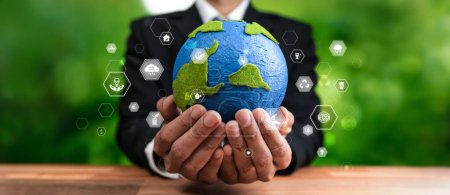 Photo for Businessman holding Earth with eco friendly icon design symbolize business company commitment to protect planet Earths ecosystem with net zero technology and ESG practice. Panorama Reliance - Royalty Free Image