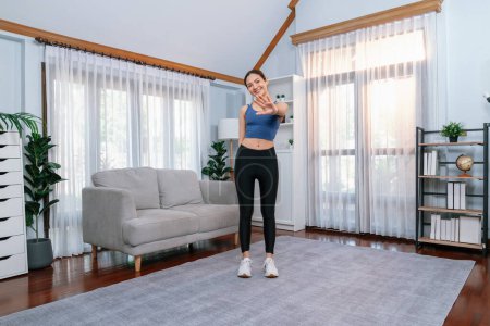 Photo for Full body asian woman in sportswear portrait, smiling and posing cheerful gesture. Home workout training with attractive girl engage in her pursuit of healthy lifestyle. Vigorous - Royalty Free Image