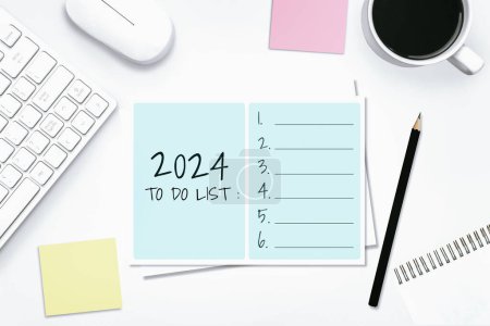 Photo for 2024 Happy New Year Resolution Goal List and Plans Setting - Business office desk with notebook written about plan listing of new year goals and resolutions setting. Change and bliss concept. - Royalty Free Image