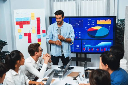 Photo for Presentation in office or meeting room with analyst team utilizing BI Fintech to analyze financial data. Businesspeople analyzing BI dashboard power display on TV screen for strategic planning.Prudent - Royalty Free Image