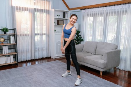 Photo for Full body asian woman in sportswear portrait, smiling and posing cheerful gesture. Home workout training with attractive girl engage in her pursuit of healthy lifestyle. Vigorous - Royalty Free Image