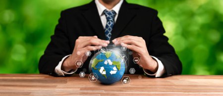 Photo for Businessperson holding and protecting Earth with recycle symbol. Business commitment to sustainable environmental protection and waste recycling practice for cleaner ecosystem. Panorama Reliance - Royalty Free Image