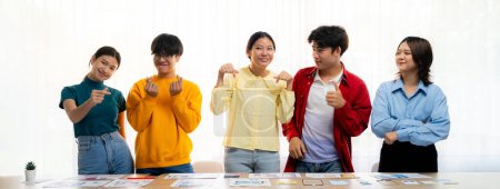 Photo for Panoramic banner young happy asian startup company employee wearing colorful casual wear stand in line together symbolize creative teamwork, job employment, HR agency recruitment. Synergic - Royalty Free Image