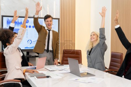 Photo for Happy diverse business team raising hand up at meeting room. Group of corporate businesspeople hand raised. Represent agreement,asking,answering,commenting,voting. Corporate team. Closeup. Ornamented. - Royalty Free Image