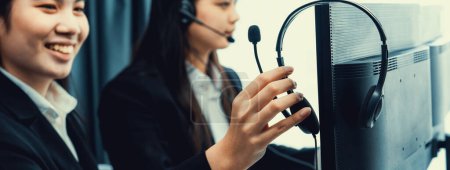 Photo for Business people wearing headset working in office to support remote customer or colleague. Call center, telemarketing, customer support agent provide service on telephone video conference oratory call - Royalty Free Image