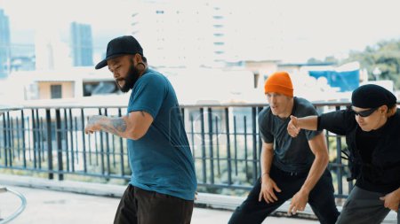 Photo for Hipster perform break dancing while partner dancing together at corridor, modern mall. Hip-hop music dancer practice footstep and move to music. Outdoor sport 2024. Active, energetic dance. Endeavor. - Royalty Free Image