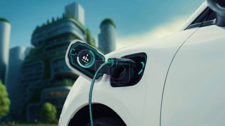 Foto de Enchufe de coche EV con estación de carga para recargar electricidad del holograma de estado de la batería del cargador EV en el parque verde como estilo de vida ecológico futurista en la ciudad y la utilización de energía limpia. Período - Imagen libre de derechos