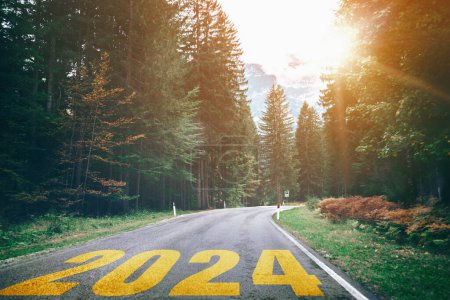 Photo for 2024 New Year road trip travel and future vision concept . Nature landscape with highway road leading forward to happy new year celebration in the beginning of 2024 for bliss and successful start . - Royalty Free Image