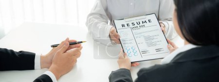 Photo for Corporate recruiter interview job applicant to discuss career goal and assess resume and experience. Job interview appointment for career opportunity and HR manager concept. Panorama Shrewd - Royalty Free Image