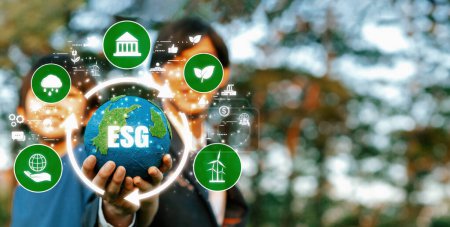 Photo for Focus planet Earth with eco friendly icon hold by blur businessman and little boy. Business investment in environmental protection by ESG sustainable technology for future generation.Panorama Reliance - Royalty Free Image