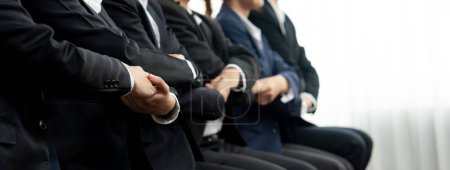 Photo for Panoramic banner business team sitting in line and join hand together symbolize successful business partnership and professional synergy for job employment, HR agency recruitment concept. Shrewd - Royalty Free Image