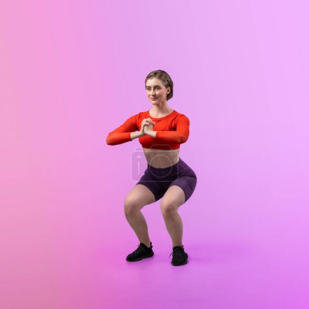 Photo for Full body length gaiety shot athletic and sporty young woman with fitness in squat exercise posture on isolated background. Healthy active and body care lifestyle. - Royalty Free Image