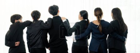 Photo for Panoramic banner back view of office worker team standing in line together with friendship posture symbolize successful professional teamwork and job employment, HR agency recruitment concept. Shrewd - Royalty Free Image