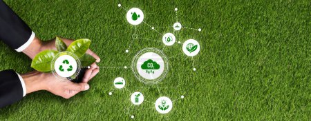 Photo for Businessman nurturing and holding plant with recycle symbol. Business commitment and investing in natural and environmental protection future sustainable ecosystem. Panorama Reliance - Royalty Free Image